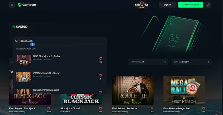 Interfaccia del casinò Gamdom che mostra una partita di blackjack live e la barra di login in alto.